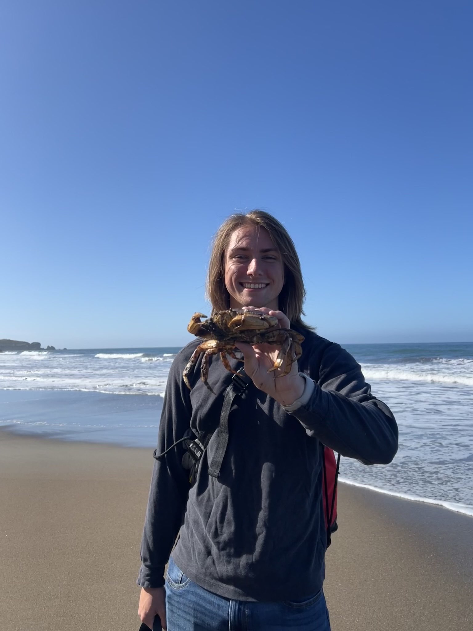 Sean with a crab at Stinson Beach